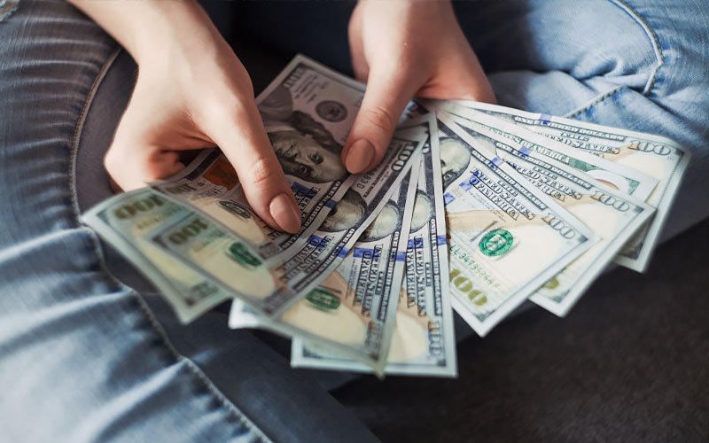 sugar baby holding money